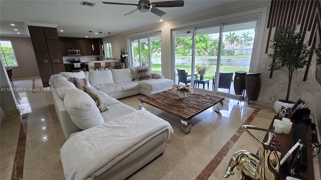 1425 Crossbill Ct, Weston, FL 33327 - living room with inlaid floor details, recessed lighting, ceiling fan, light marble finish floors, and ornamental molding