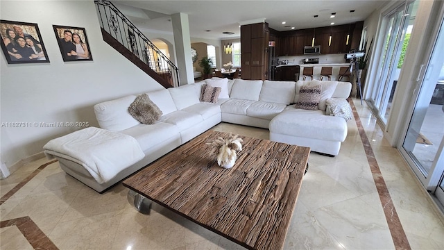 1425 Crossbill Ct, Weston, FL 33327 - living area featuring inlaid floor details, arched walkways, stairway, light marble finish floors, and recessed lighting