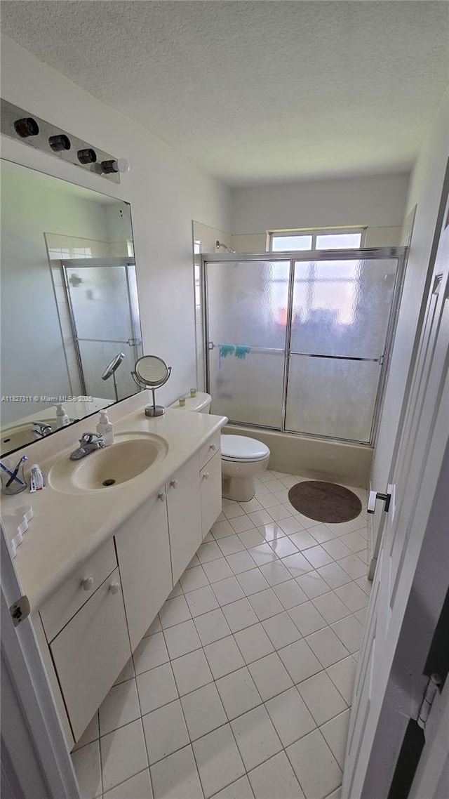 1425 Crossbill Ct, Weston, FL 33327 - full bathroom featuring vanity, tile patterned flooring, and a textured ceiling