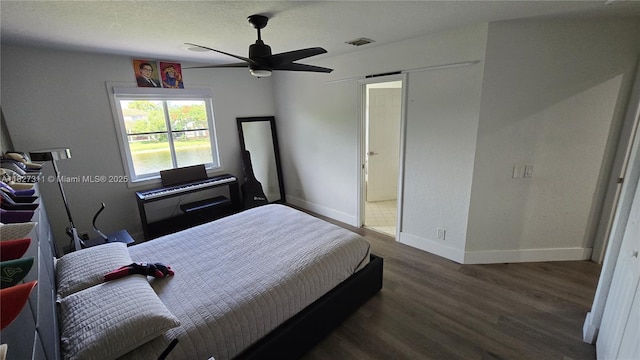 1425 Crossbill Ct, Weston, FL 33327 - bedroom with wood finished floors and ceiling fan