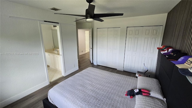 1425 Crossbill Ct, Weston, FL 33327 - bedroom featuring two closets, wood finished floors, and a ceiling fan