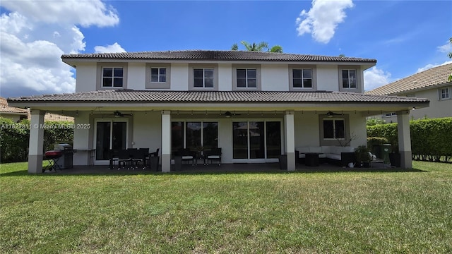 1425 Crossbill Ct, Weston, FL 33327 - back of house featuring a ceiling fan, an outdoor hangout area, stucco siding, and a lawn