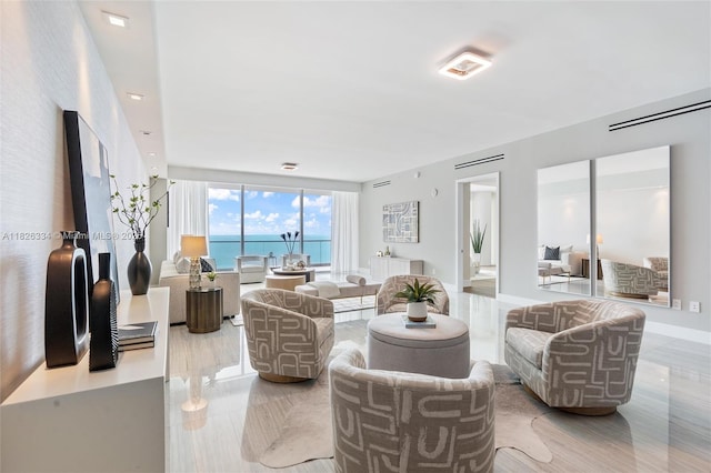 10203 Collins Ave Unit 1603, Bal Harbour, FL 33154 - living room with a water view and tile patterned flooring