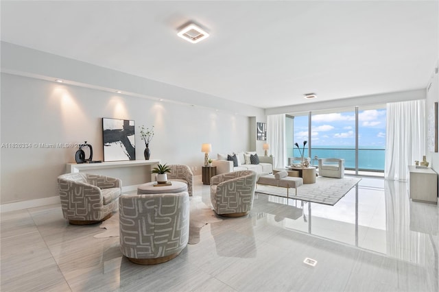 10203 Collins Ave Unit 1603, Bal Harbour, FL 33154 - living area featuring a water view and a wall of windows