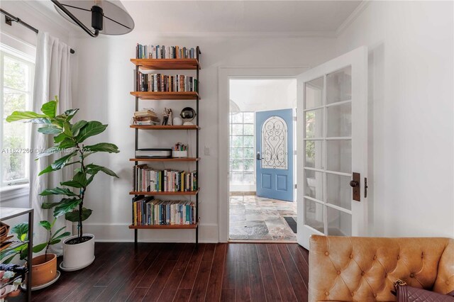 1210 Genoa St, Coral Gables, FL 33134 - foyer entrance with wood finished floors, crown molding, and plenty of natural light