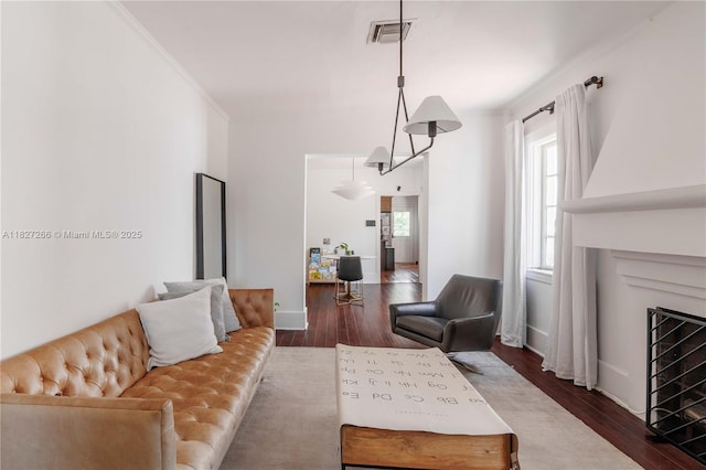 1210 Genoa St, Coral Gables, FL 33134 - living room with dark wood finished floors, a fireplace, and crown molding