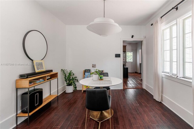 1210 Genoa St, Coral Gables, FL 33134 - dining area with baseboards and wood finished floors