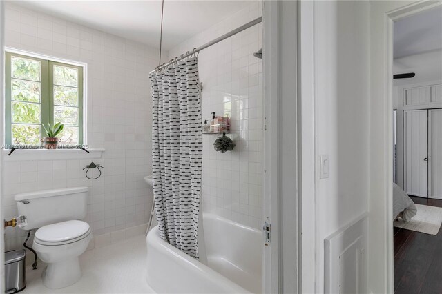 1210 Genoa St, Coral Gables, FL 33134 - bathroom featuring shower / bath combo with shower curtain, tile walls, and wood finished floors
