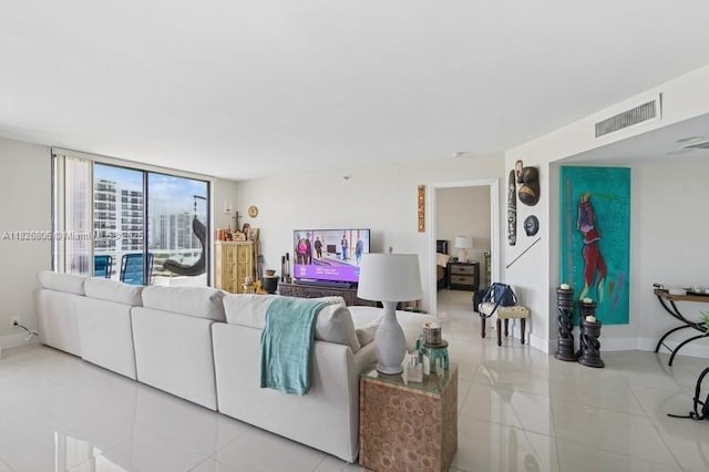 3300 NE 192nd St Unit 1707, Aventura, FL 33180 - tiled living area featuring baseboards