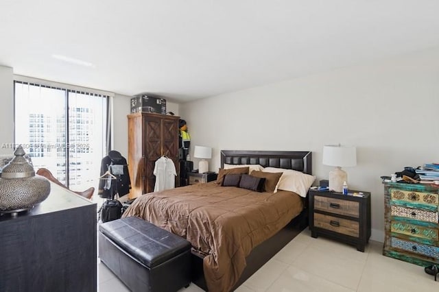 3300 NE 192nd St Unit 1707, Aventura, FL 33180 - bedroom with light tile patterned flooring