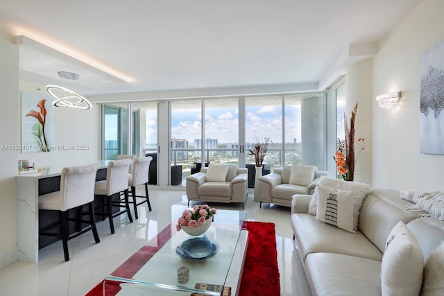 16400 Collins Ave Unit 1845, Sunny Isles Beach, FL 33160 - living area with light tile patterned floors, a wall of windows, and a chandelier