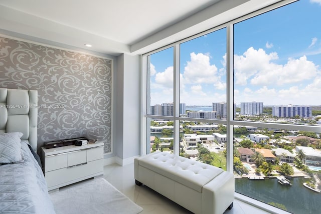16400 Collins Ave Unit 1845, Sunny Isles Beach, FL 33160 - bedroom featuring wallpapered walls, a view of city, a water view, and expansive windows