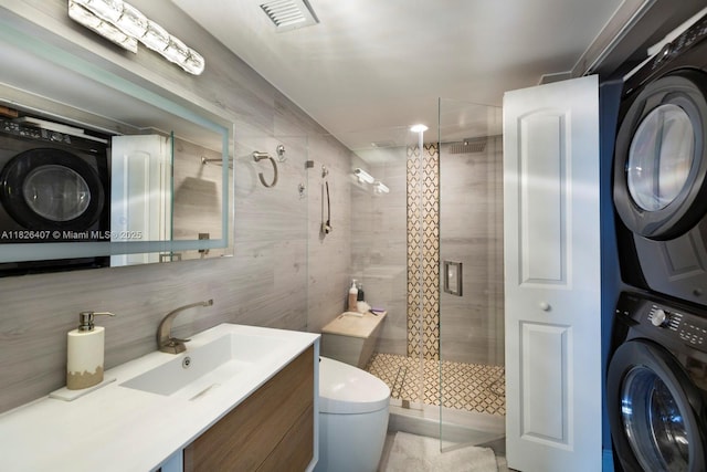 16400 Collins Ave Unit 1845, Sunny Isles Beach, FL 33160 - bathroom with stacked washer and clothes dryer, a shower stall, and vanity
