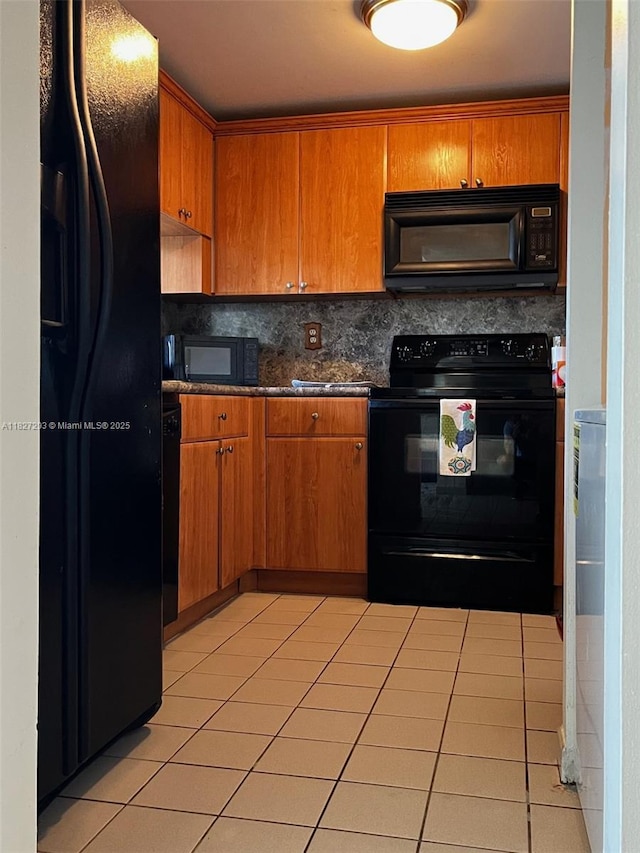 11790 SW 18th St Unit 321-3, Miami, FL 33175 - kitchen featuring black appliances, light tile patterned flooring, decorative backsplash, and brown cabinets