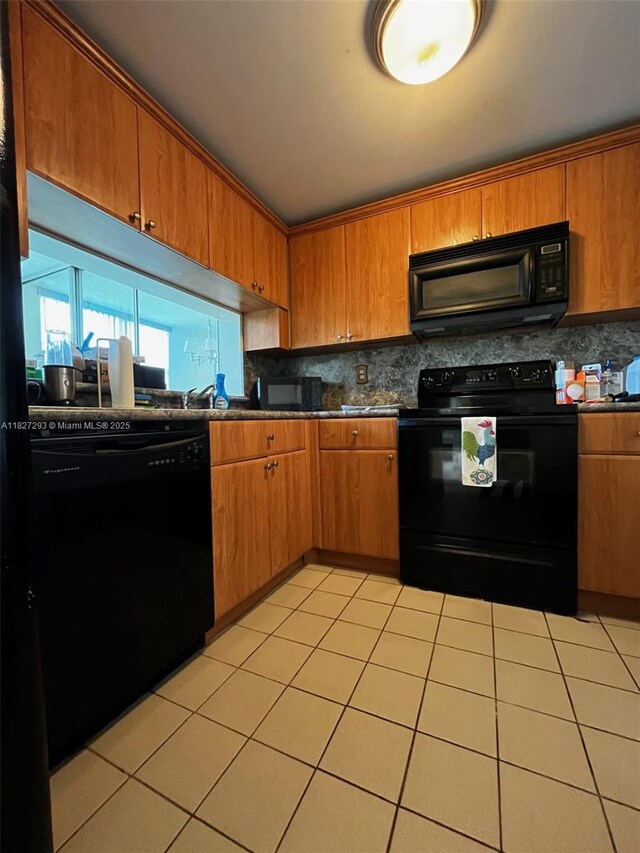 11790 SW 18th St Unit 321-3, Miami, FL 33175 - kitchen featuring black appliances, tasteful backsplash, dark countertops, and light tile patterned floors