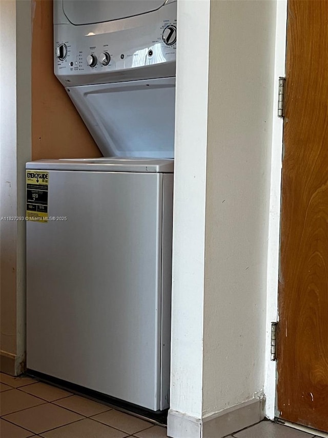 11790 SW 18th St Unit 321-3, Miami, FL 33175 - laundry area featuring estacked washer and dryer and light tile patterned floors