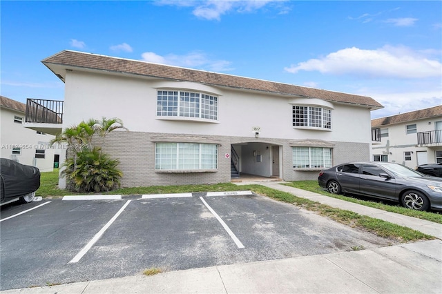 1817 NW 54th Ter Unit Bb4, Lauderhill, FL 33313 - townhome / multi-family property featuring uncovered parking, brick siding, and stucco siding