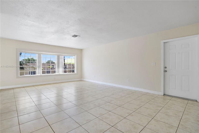 1817 NW 54th Ter Unit Bb4, Lauderhill, FL 33313 - unfurnished room with a textured ceiling and light tile patterned flooring