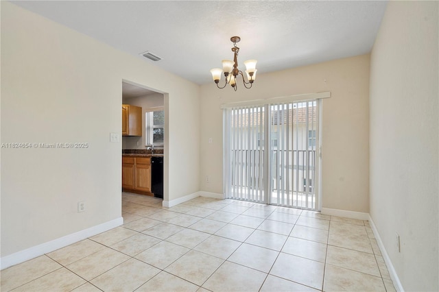 1817 NW 54th Ter Unit Bb4, Lauderhill, FL 33313 - spare room featuring a chandelier and light tile patterned floors