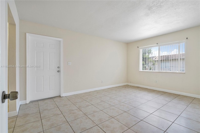1817 NW 54th Ter Unit Bb4, Lauderhill, FL 33313 - unfurnished room with light tile patterned floors and a textured ceiling