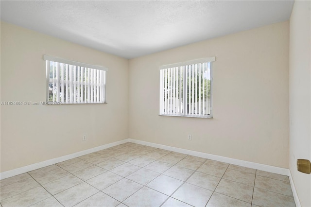 1817 NW 54th Ter Unit Bb4, Lauderhill, FL 33313 - empty room with tile patterned floors and baseboards