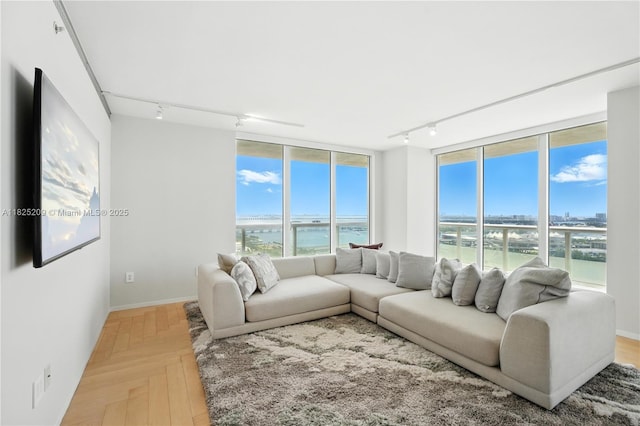 50 Biscayne Blvd Unit 3002, Miami, FL 33132 - living room featuring rail lighting, a water view, and floor to ceiling windows