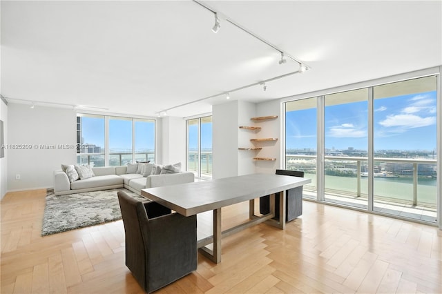 50 Biscayne Blvd Unit 3002, Miami, FL 33132 - dining space featuring rail lighting, floor to ceiling windows, and a water view