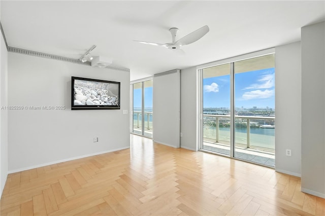 50 Biscayne Blvd Unit 3002, Miami, FL 33132 - unfurnished room featuring a wall of windows, track lighting, a water view, and ceiling fan