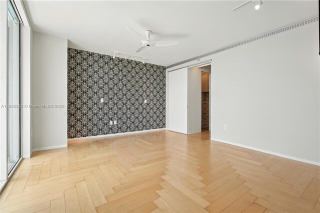 50 Biscayne Blvd Unit 3002, Miami, FL 33132 - spare room with wallpapered walls, an accent wall, and a ceiling fan