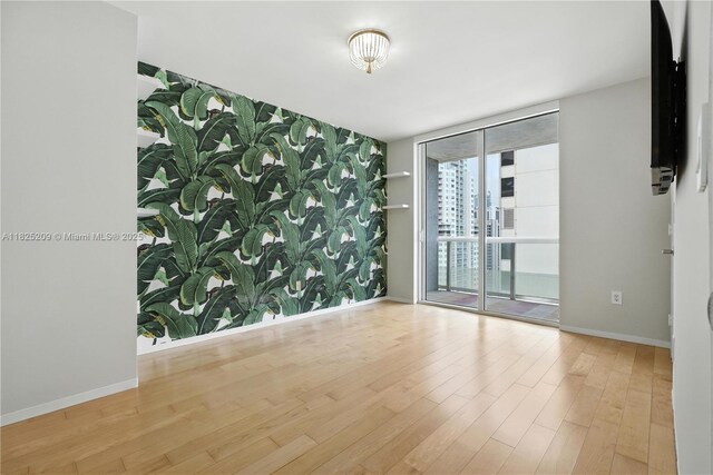 50 Biscayne Blvd Unit 3002, Miami, FL 33132 - unfurnished room featuring wood finished floors and expansive windows