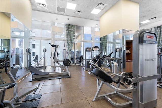 50 Biscayne Blvd Unit 3002, Miami, FL 33132 - workout area featuring a paneled ceiling and a towering ceiling