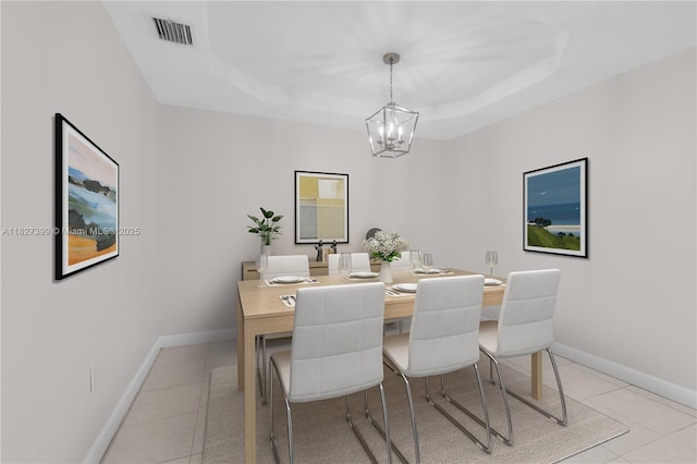 8122 SW 119th Ct Unit 8122, Miami, FL 33183 - dining space with light tile patterned floors, a chandelier, and a tray ceiling