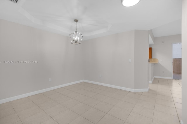 8122 SW 119th Ct Unit 8122, Miami, FL 33183 - unfurnished room featuring a chandelier, light tile patterned flooring, and a raised ceiling