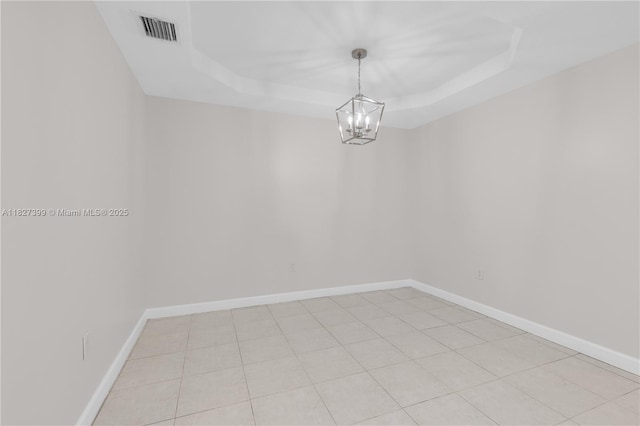 8122 SW 119th Ct Unit 8122, Miami, FL 33183 - spare room with a tray ceiling and a chandelier