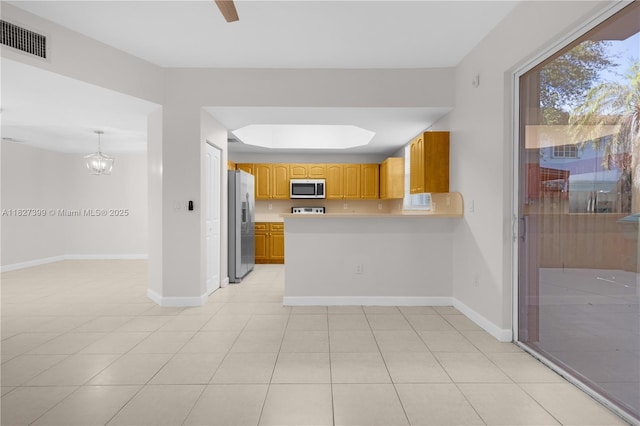 8122 SW 119th Ct Unit 8122, Miami, FL 33183 - kitchen with appliances with stainless steel finishes, light countertops, a peninsula, and light tile patterned floors