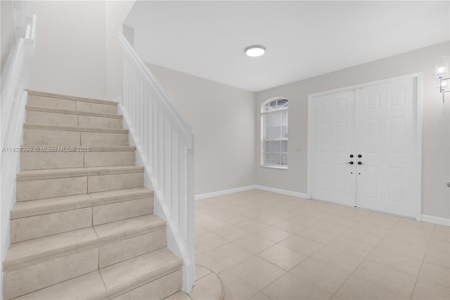 8122 SW 119th Ct Unit 8122, Miami, FL 33183 - foyer featuring stairway and baseboards