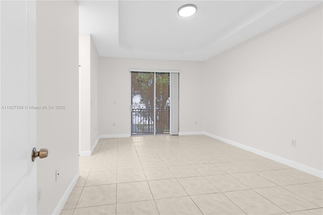 8122 SW 119th Ct Unit 8122, Miami, FL 33183 - spare room with light tile patterned floors and a raised ceiling
