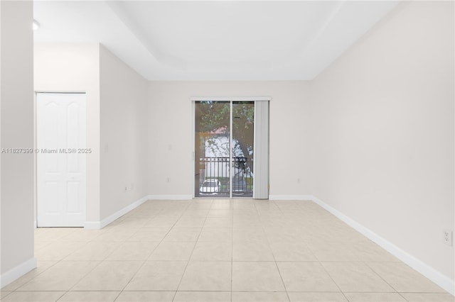 8122 SW 119th Ct Unit 8122, Miami, FL 33183 - empty room featuring light tile patterned floors and a tray ceiling