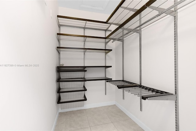 8122 SW 119th Ct Unit 8122, Miami, FL 33183 - spacious closet featuring light tile patterned flooring