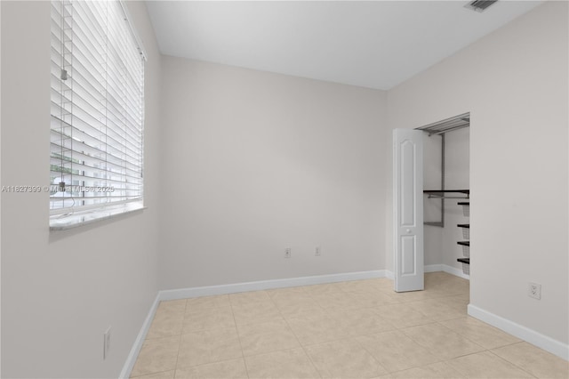 8122 SW 119th Ct Unit 8122, Miami, FL 33183 - unfurnished bedroom featuring multiple windows and light tile patterned floors