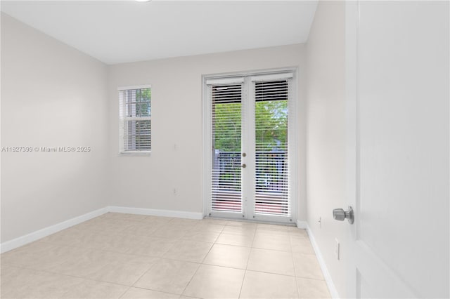 8122 SW 119th Ct Unit 8122, Miami, FL 33183 - spare room with baseboards and light tile patterned flooring