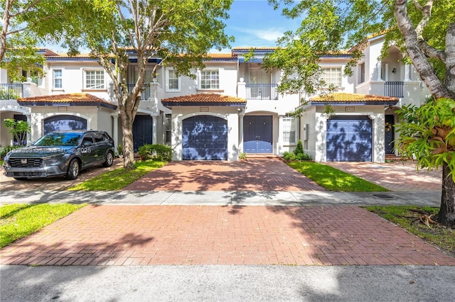 8122 SW 119th Ct Unit 8122, Miami, FL 33183 - mediterranean / spanish-style house with a balcony, stucco siding, driveway, and a tile roof