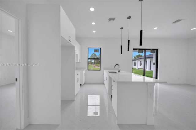 643 Knapp St, Lehigh Acres, FL 33974 - kitchen featuring modern cabinets, white cabinets, light countertops, recessed lighting, and pendant lighting