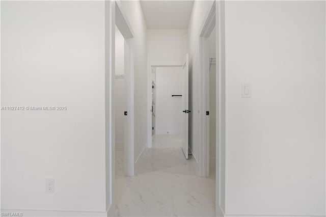643 Knapp St, Lehigh Acres, FL 33974 - hallway with marble look tile flooring and baseboards