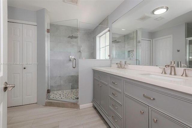 315 W Cypress Cove Cir, Davie, FL 33325 - bathroom featuring double vanity, a shower stall, and a closet