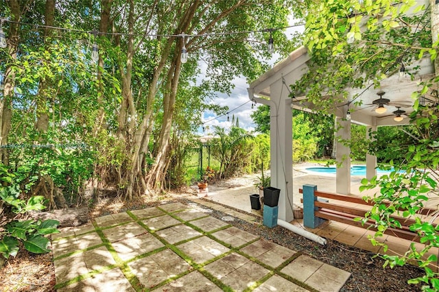 315 W Cypress Cove Cir, Davie, FL 33325 - fenced backyard with a patio and ceiling fan
