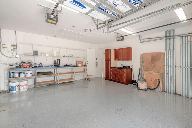 315 W Cypress Cove Cir, Davie, FL 33325 - garage with a garage door opener and a workshop area