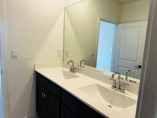 1672 SE 8th Ave, Homestead, FL 33034 - bathroom with double vanity and a textured wall