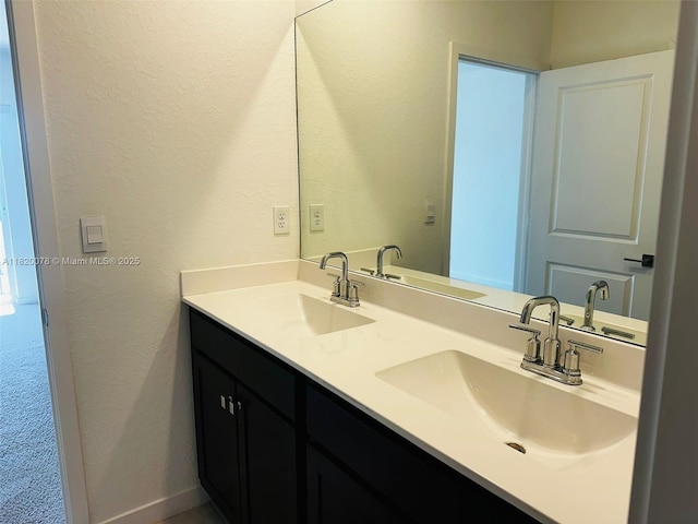 1672 SE 8th Ave, Homestead, FL 33034 - bathroom with double vanity and a textured wall