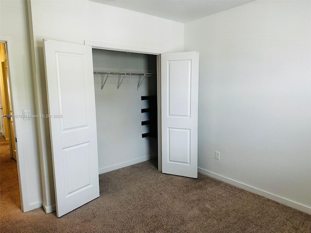 1672 SE 8th Ave, Homestead, FL 33034 - unfurnished bedroom with carpet and a closet